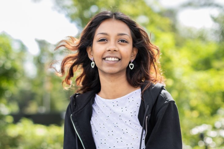 Student Janisha smiles into the camera