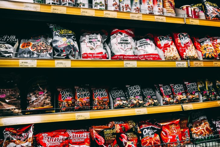 Shelves with snacks in an Asian supermarket.